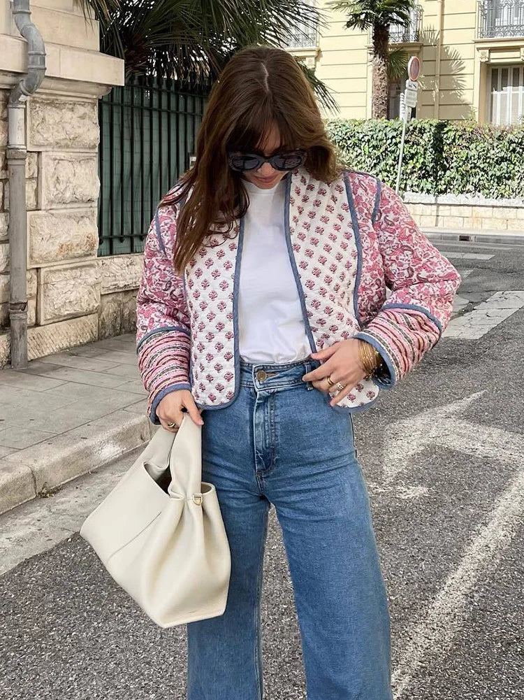 Juliette pink floral quilted jacket styled on a model with blue jeans