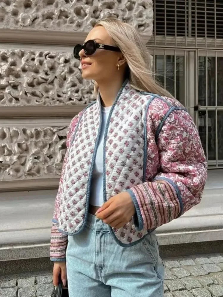 Juliette pink floral quilted jacket styled on a model with blue jeans